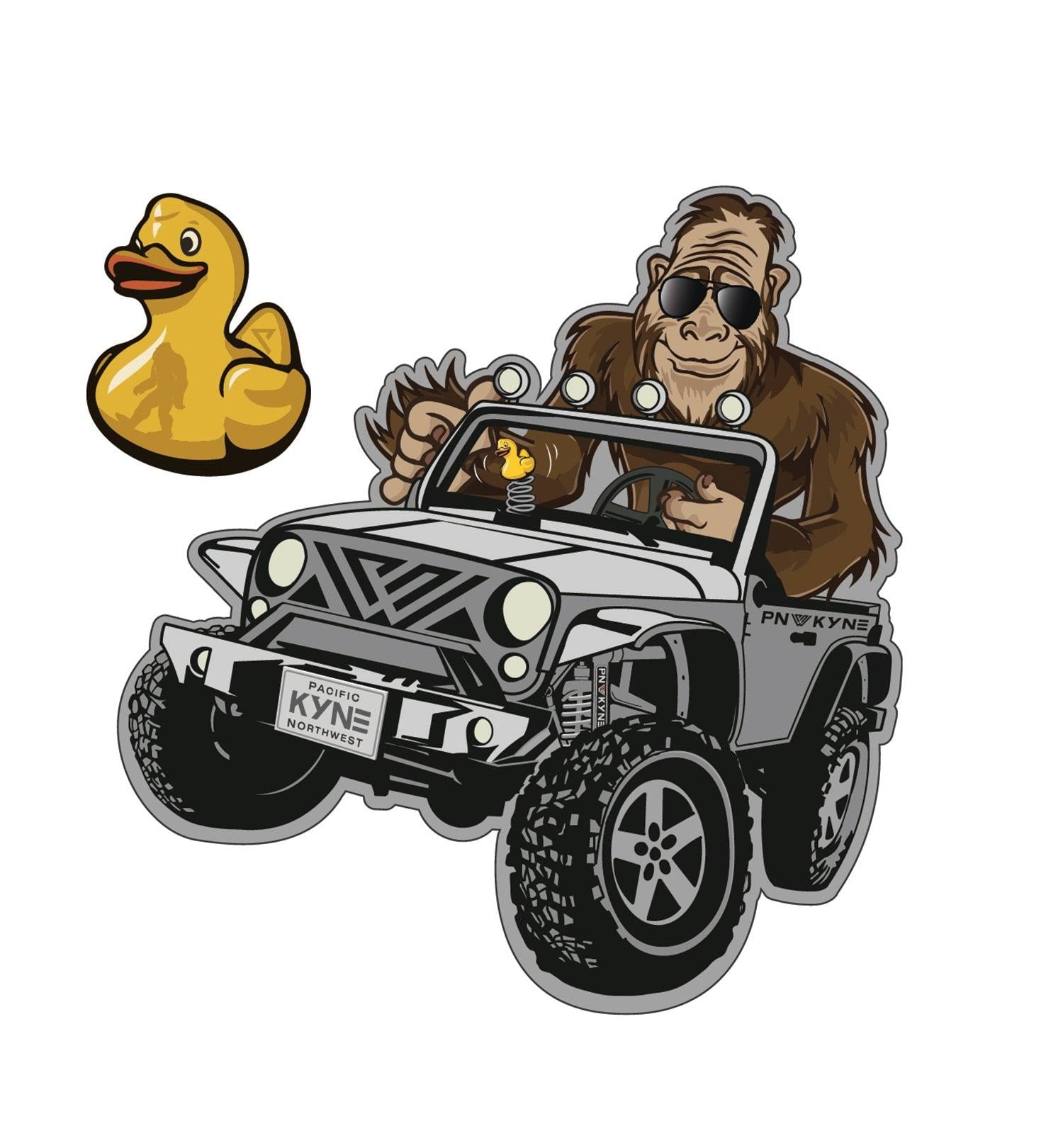 Sticker of a Bigfoot driving a jeep with a rubber duck, branded 'PNW Kyne'.