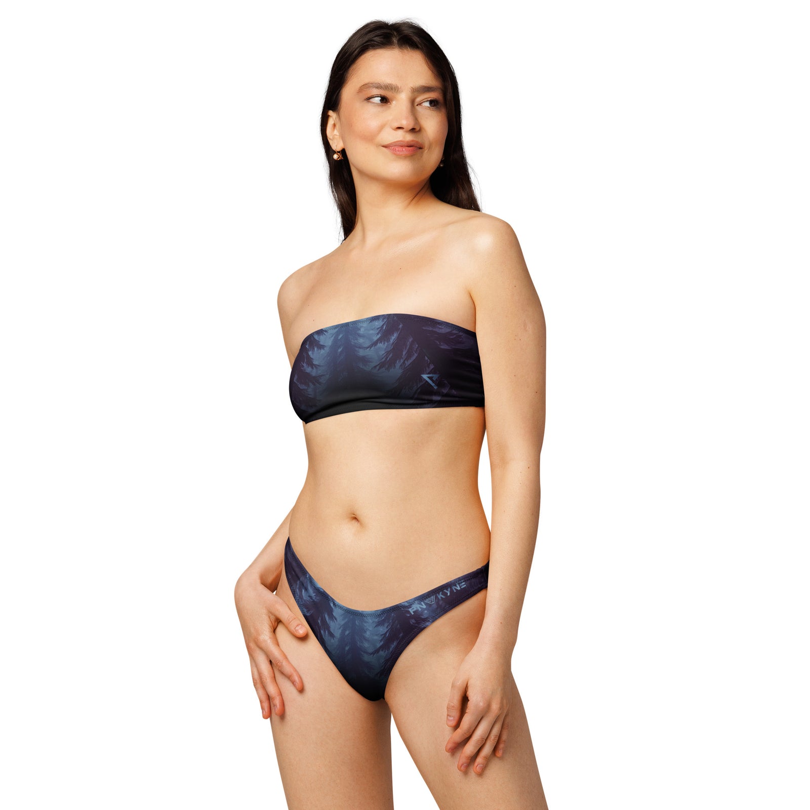 Woman wearing a blue bandeau bikini with a Pacific Northwest printed design on a white background