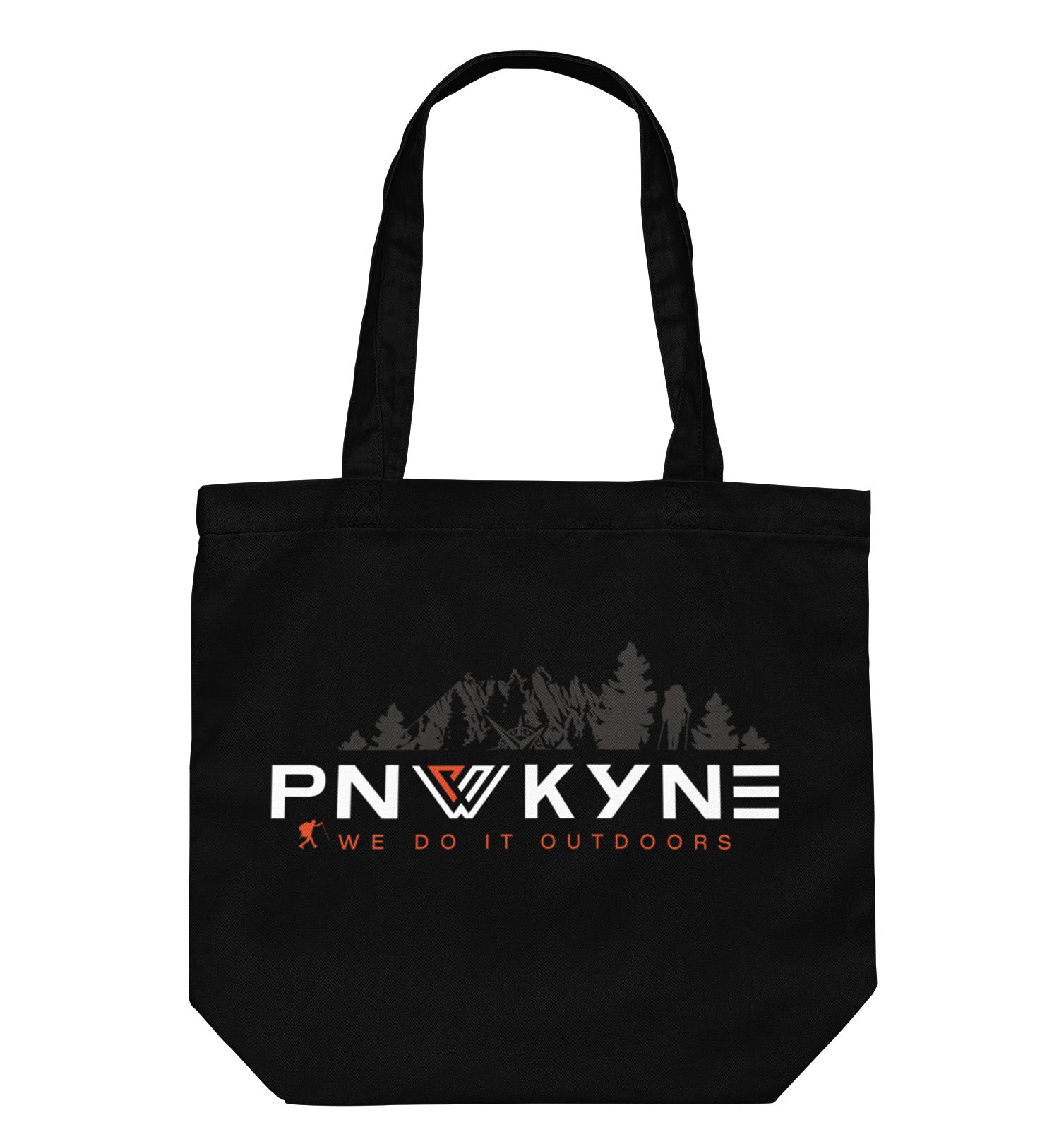 PNW KYNE Classic Tote Bag in a parking lot by the forest