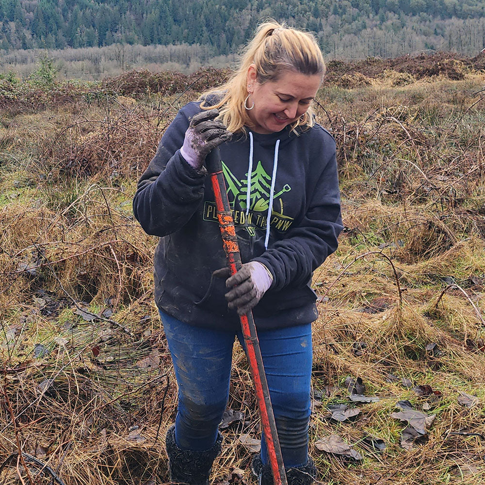 Brianna from PNW KYNE digging a hole