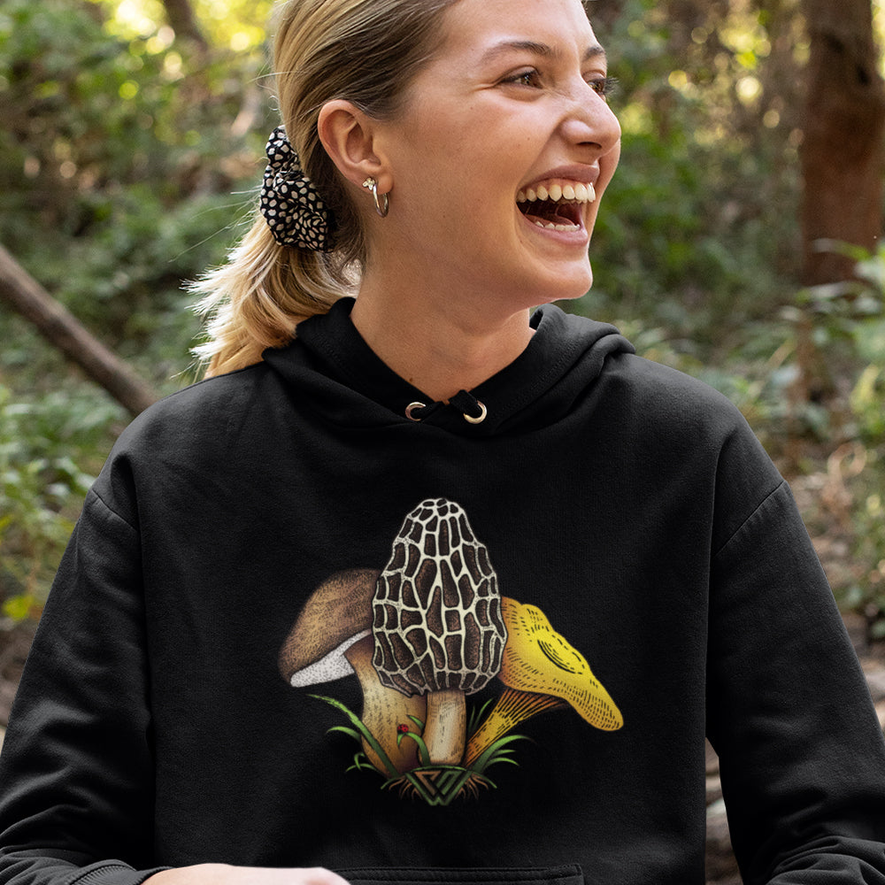 Woman wearing a PNW Funguys pullover hoodie in the woods
