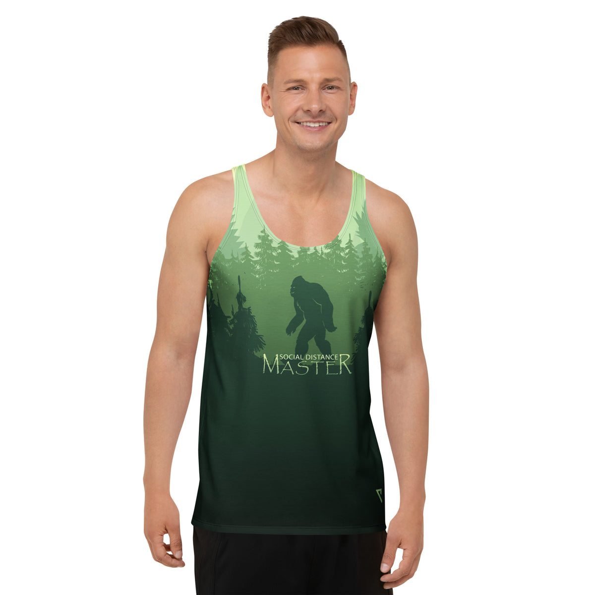 Man wearing a green sasquatch themed tank top with a graphic design image of Bigfoot in a forest, on a white background