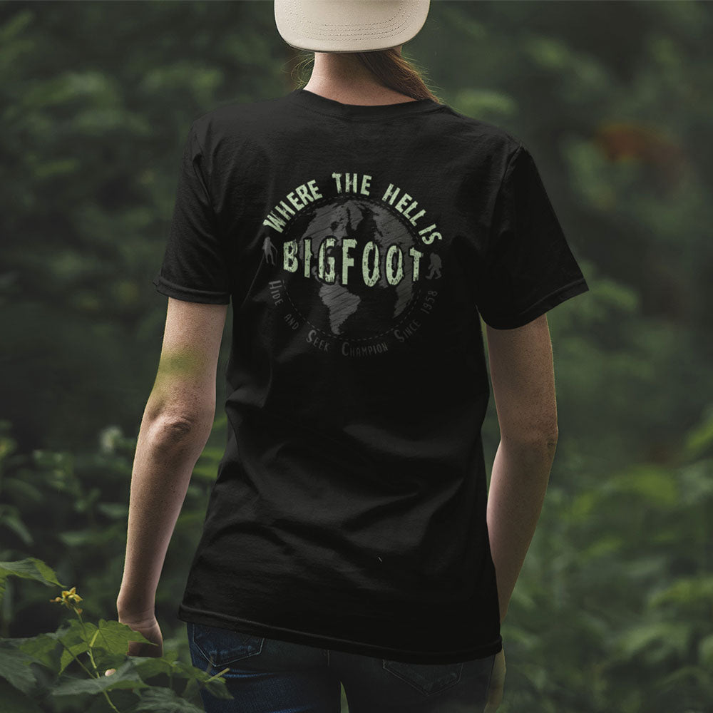Woman walking through forest with Where the Hell is Bigfoot shirt