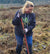 Woman wearing a Planted in the PNW Pullover hoodie while planting trees